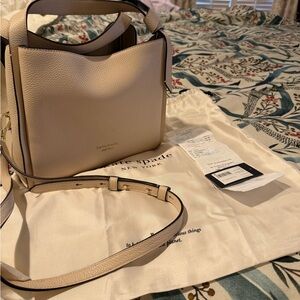 kate spade beige pebble leather crossbody with gold-tone logo